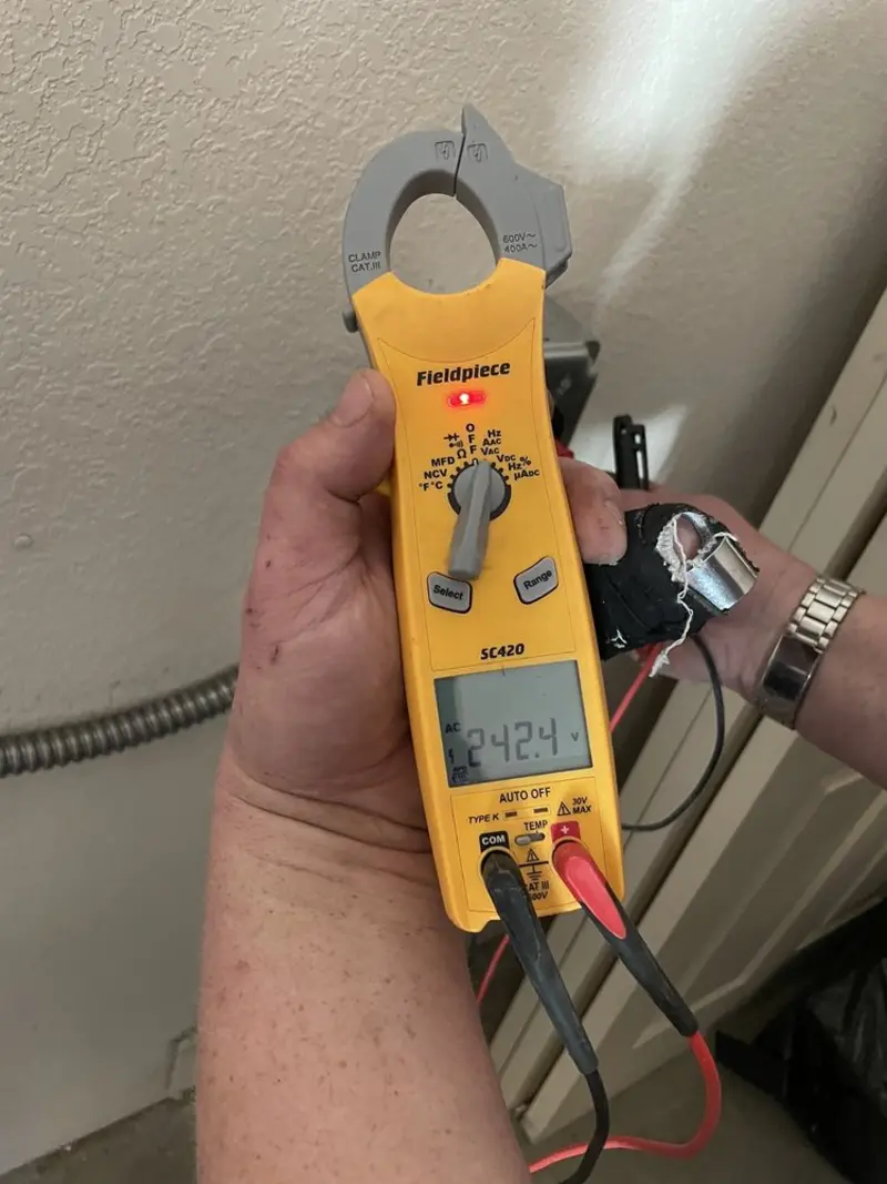 Voltage testing with clamp meter during Ceiling Fan Installation in Willowbrook